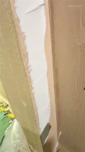 applying joint compound to smooth and level corner wall joints with a putty knife