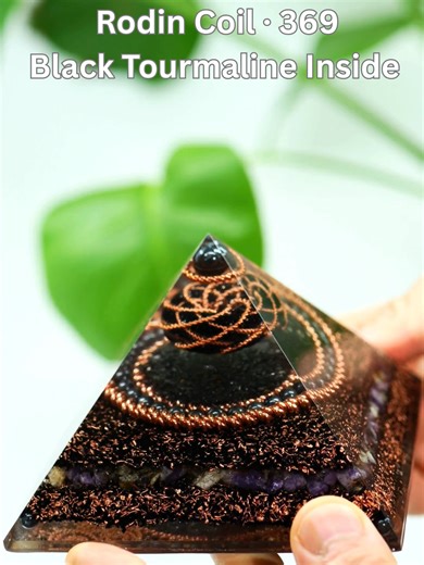 This EMF Protection pyramid is built with Karelia Elite Shungite as the primary stone, combined with a 369 Rodin Coil system to stabilize and shield energy around electronics. Black tourmaline is placed inside the Rodin Coil, supported by hematite, lepidolite, and fluorite to ground, calm, and strengthen the protective field. Handcrafted with copper tensor geometry for focused EMF defense. . . . . .#emfprotection #eliteshungite #rodincoil #energyshield #cosmoorgonite .