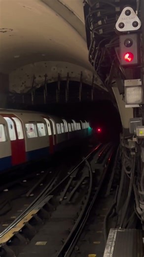 Bakerloo line train departing with sparks