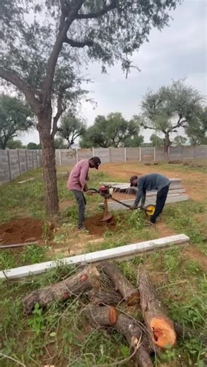 This is how the pit is dug by the labourer using a hand machine#boundarywall