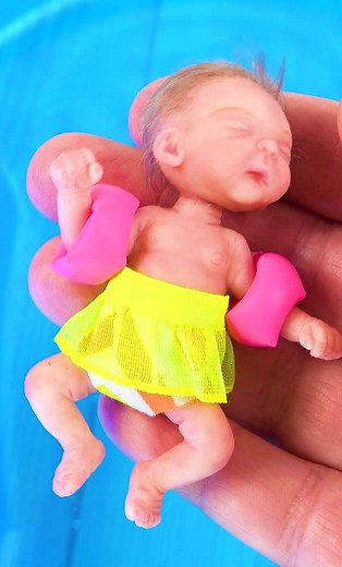 ‏Miniature baby in the swimming pool (by Pipe Cleaner Crafts B)