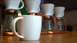 How to making coffee drip with hot water, roasted coffee beans on filter, Hot water pouring to roasted coffee for fresh drip coffee. Industrial food and drink concept.