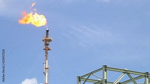 Fire on flare stack at oil and gas central processing platform release over pressure from process. Petroleum refinery plant