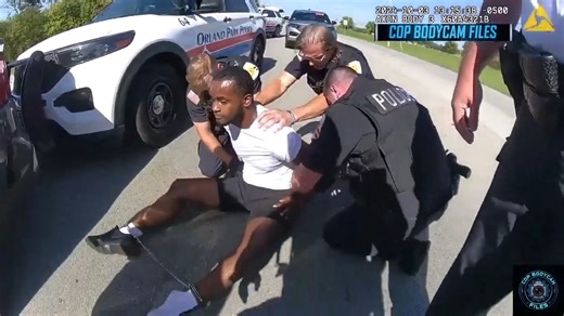 PART 5 🚨 Reality Check at the Station! 🛑 SOVEREIGN SHOWDOWN: Entitled Traveler Demands Cash for ID! 🚨 FOLLOW FOR MORE BODYCAM CONTENT 🚨 The scene shifts to the police station's secure garage. As the man is escorted inside for processing, he is still loudly spouting sovereign nonsense and demanding proof that the officers have jurisdiction over him. When officers ignore his arguments and begin to book him like any other arrestee, the look on his face changes. He finally realizes none of his p