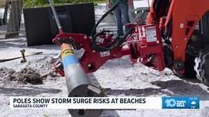 Poles demonstrate storm surge risk at Sarasota beaches