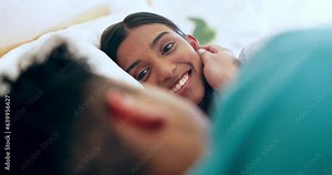 People in bed together, pillow talk and love with communication, couple relax and happy with trust and support. Commitment, partner and healthy relationship, woman and man with story and smile