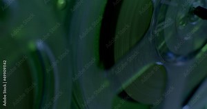 The use of magnetic tape in a reel-to-reel tape recorder for recording and playing back audio and music. Night room, spy work.