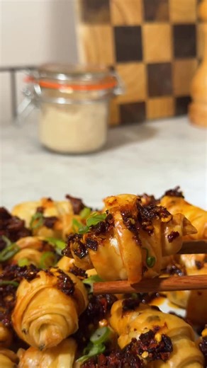 These scallion pancake croissants are the lazy snack you didn’t know you needed. 🥐 Simply defrost a packet of scallion (or spring onion!) pancakes, slice into long triangles and roll them into mini croissants. Air fry at 180C for 20 minutes or until golden and flaky. Serve with chilli crisp and sliced spring onion greens, and try not to eat the whole tray standing over the air fryer (good luck with that). | Twisted