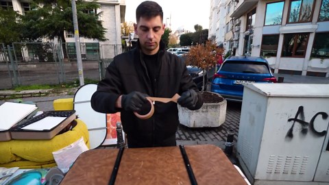 Watch this artist transform a leather briefcase with spray paint