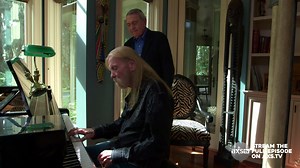 Gregg Allman plays a tune on his piano at his beautiful lakeside house in Georgia. | AXS TV
