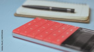 Calculator and notepad on desk. Working space. Close-up view of accountant work desktop