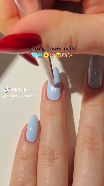 Spring flower nails! A cute & minimal spring nail design in the prettiest light blue shade ever! Save for your next nails appointment. #nails #nailart #nailsofinstagram #manicure #gelnails #naildesign #nailstagram #acrylicnails #nailsoftheday #nailpolish #WarnerRobinsNails #WarnerRobinsNailSalon #NailsOfWarnerRobins #WRNails #eyelashextensions #lashes #lashextensions #lashartist #lashlift #waxing #waxingservices #bodywaxing #summernails #SpringVibes #NailArt