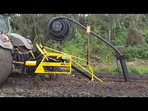 AFT100 trenching & laying drainge pipe in heavy clay & very wet conditions