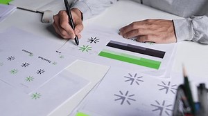 clip-3507955231-young-asian-graphic-designer-working-office-designing