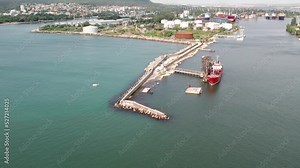 Red tanker ship loading and unloading oil and gas storage at industrial dock port, Business import export petrol and chemical by tanker ship