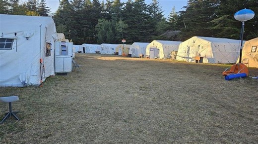 Anvil and Flat Fires containment progress amidst impending weather challenges: Evacuation levels reduced and roads reopened