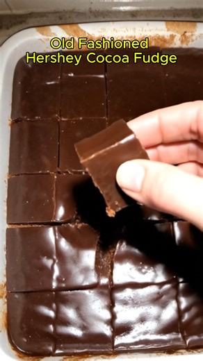 Old Fashioned Hershey Cocoa Fudge Ingredients: 2 cups granulated sugar 3/4 cup Hershey's cocoa powder 1/2 cup milk 1/2 cup (1 stick) unsalted butter 1 tsp vanilla extract Pinch of salt Instructions: Line an 8-inch square baking dish with parchment paper and set aside. In a medium saucepan, combine the sugar, cocoa powder, and salt. Gradually add the milk while stirring constantly until the mixture is smooth. Add the butter and stir until it melts and blends in. Bring the mixture to a boil over m