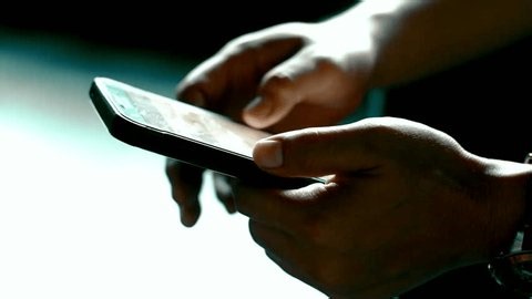 clip-3999711257-close-up-hands-operating-smartphone-tapping-scrolling ...
