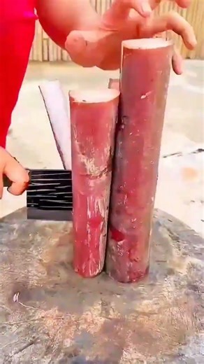 Multi-blade knife slices fish—hands guide rhythm of parallel cuts, clean line and swift preparation