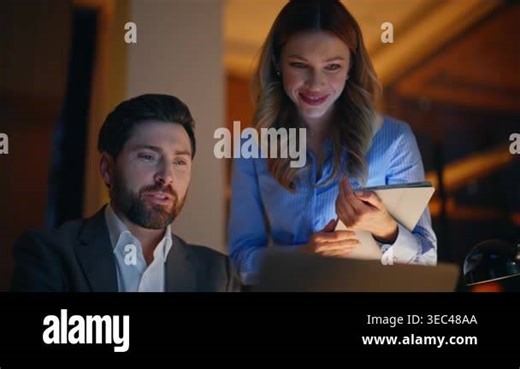 Two managers greeting webcam laptop starting online conference in night office closeup. Happy colleagues talking emotionally sharing great news at virtual meeting late evening. Successful teamwork Stock Video Footage - Alamy