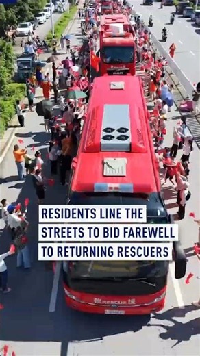 Residents line the streets to bid farewell to returning rescuers