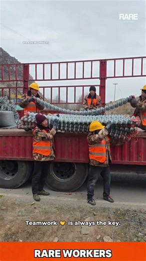 Heavy Lifting: Teamwork Unloads Metal Mesh