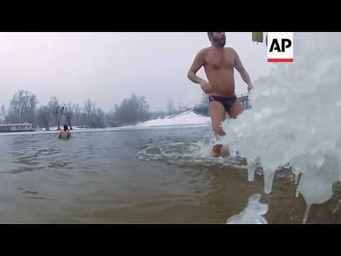 Epiphany marked with ice swim in Russia, Ukriane