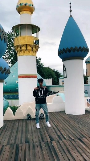 Dancing Arab Boy in Colorful Outdoor Setting