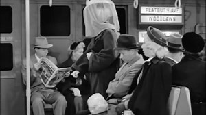 #TransitTrivia: In this clip from the 1957 "I Love Lucy" episode “Lucy and the Loving Cup,” Lucille Ball rides the #NYCsubway with a trophy stuck on her head. Unable to see, she gets herself into several awkward situations. The episode was filmed on a set designed to look like a subway car that was running at the time. Do you know which car model it was meant to resemble? What inconsistencies do you notice? | New York Transit Museum