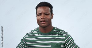 Hands, yawn and face of tired man in studio with burnout, low energy or exhausted on blue background. Fatigue, portrait and African male model with yawning emoji for sleepy, lazy or bored gesture
