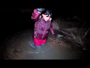 WetLook 223 girl in waders and snobord pants in deep water