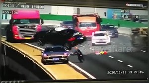 Car flips over and flies off bridge after dramatic collision with truck on Chinese highway