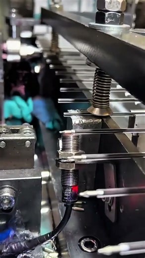 Sensor threads gleam—metal pins align, morning calibrates motion with silent industrial grace