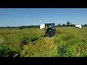 John Deere 5075E Compact Tractor Cutting overgrown tall grass with Kodiak Rotary Cutter.