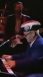 On this day in 1947: Elton John was born. In 1988, Elton, Eric, Mark Knopfler and more performed Elton's "I Don't Wanna Go On With You Like That" live in Tokyo. | Eric Clapton