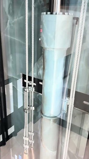 Glass-Walled Home Elevator with Marble Rail Wall | Hobe Sound, FL