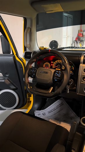 Time wheels customs on Instagram: "Upgrade your Toyota FJ Cruiser with the latest Prado-style carbon D-shape steering wheel 🖤 Sporty grip, premium carbon finish, and perfect OEM-style fit. ✔ Compatible with steering wheel controls (Android system ready) ✔ Modern sport design for better driving feel ✔ Professional installation available in UAE 🇦🇪 DM now — my team will send full details. Prado steering wheel FJ Cruiser Carbon D shape steering wheel FJ FJ Cruiser steering wheel upgrade Toyota FJ