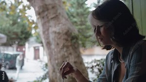 Woman sitting alone in a Cafe drinking coffee