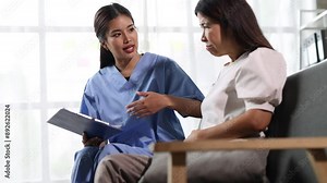 Doctor is diagnosing and giving medicine to a patient with diarrhea. Senior woman with abdominal pain and diarrhea is talking with a doctor in an examination room at a hospital.