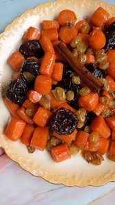 The Jewish holiday sweet stew staple. Tzimmes in Yiddish means “a big fuss”. It’s also the name of this traditional Jewish Ashkenazi dish of stewed root vegetables and fruits. Tzimmes is a dish that screams Fall and comfort and the start of a sweet new year. 🍁🥕🍯 It is the perfect Jewish dish to make any time, but especially for adding sweetness to Rosh Hashanah meals.😋 Don’t worry it’s no fuss to make 😉 Find the recipe at https://aish.com/tzimmes/ Credit Mama Living Abroad #tzimmes #roshhas