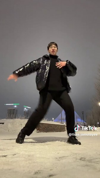 Nighttime Dance Performance in a Snowy Setting