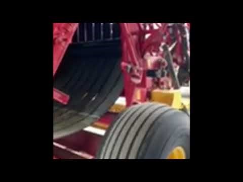 How to adjust belt tension on NEW HOLLAND RB560