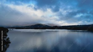 Lake District Keswick Derentwater England. Drone flies over lake with Lakeland Mountains in view. Scenic Cinematic. Dusk Early Morning Stock Video