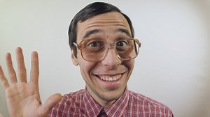 Nerdy man says hello and flirts - Free Stock Video