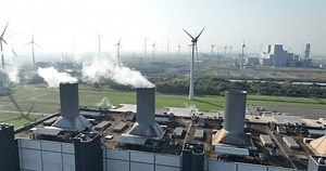 Smoking smoke stacks, showcasing fossil fuels, energy production.