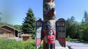Proud Raven totem pole at Saxman Totem Park