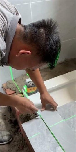 take the ceramic tile to measure how much needs to be cut and reinstalled #contruction #shortvideo