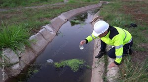 Environmental engineers and scientists inspecting water quality before treatment for potable use,checking water pollution,testing contaminants,collecting water samples for lab analysis to ensure safe