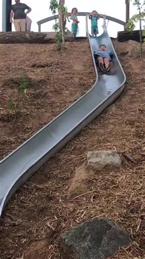 Woman Loses Control on Slide During Family Vacation