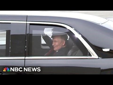 Putin grins from inside Trump's presidential vehicle at Alaska arrival ceremony